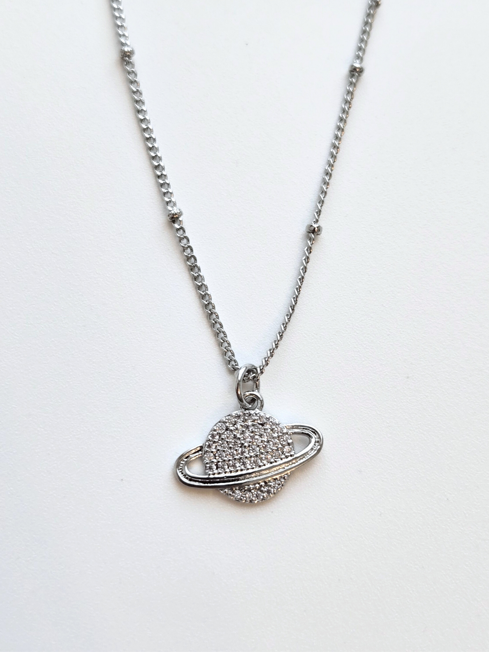 056 | silver saturn necklace