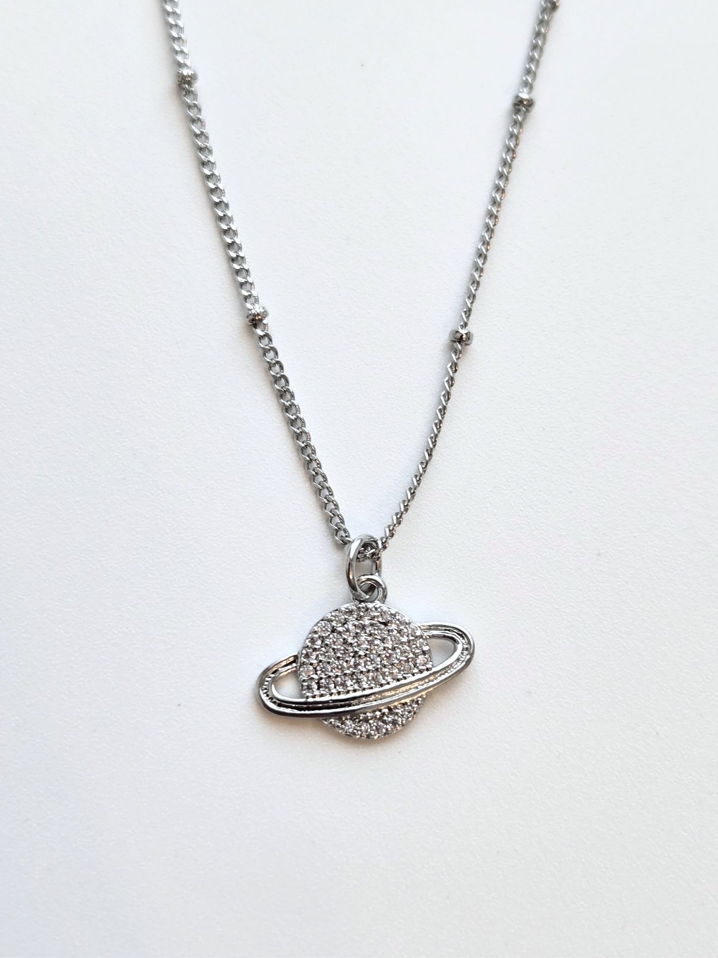 056 | silver saturn necklace